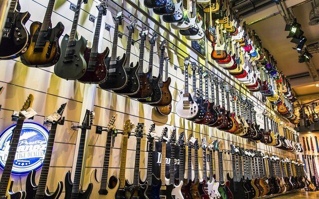 musikhaus - wall full of guitars